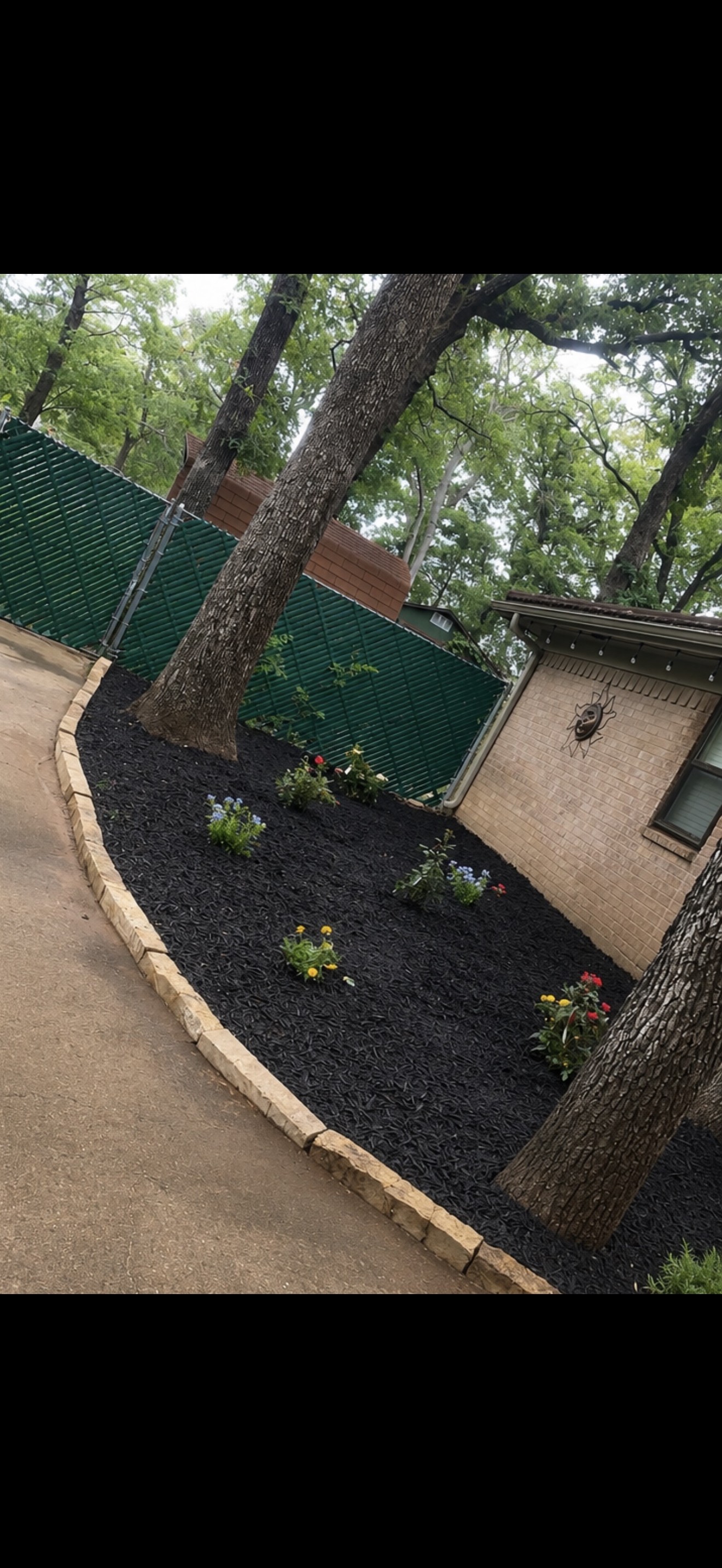 Fresh black mulch flower bed